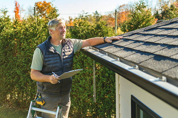 Professional Roofing technician working in Muscatine, IA